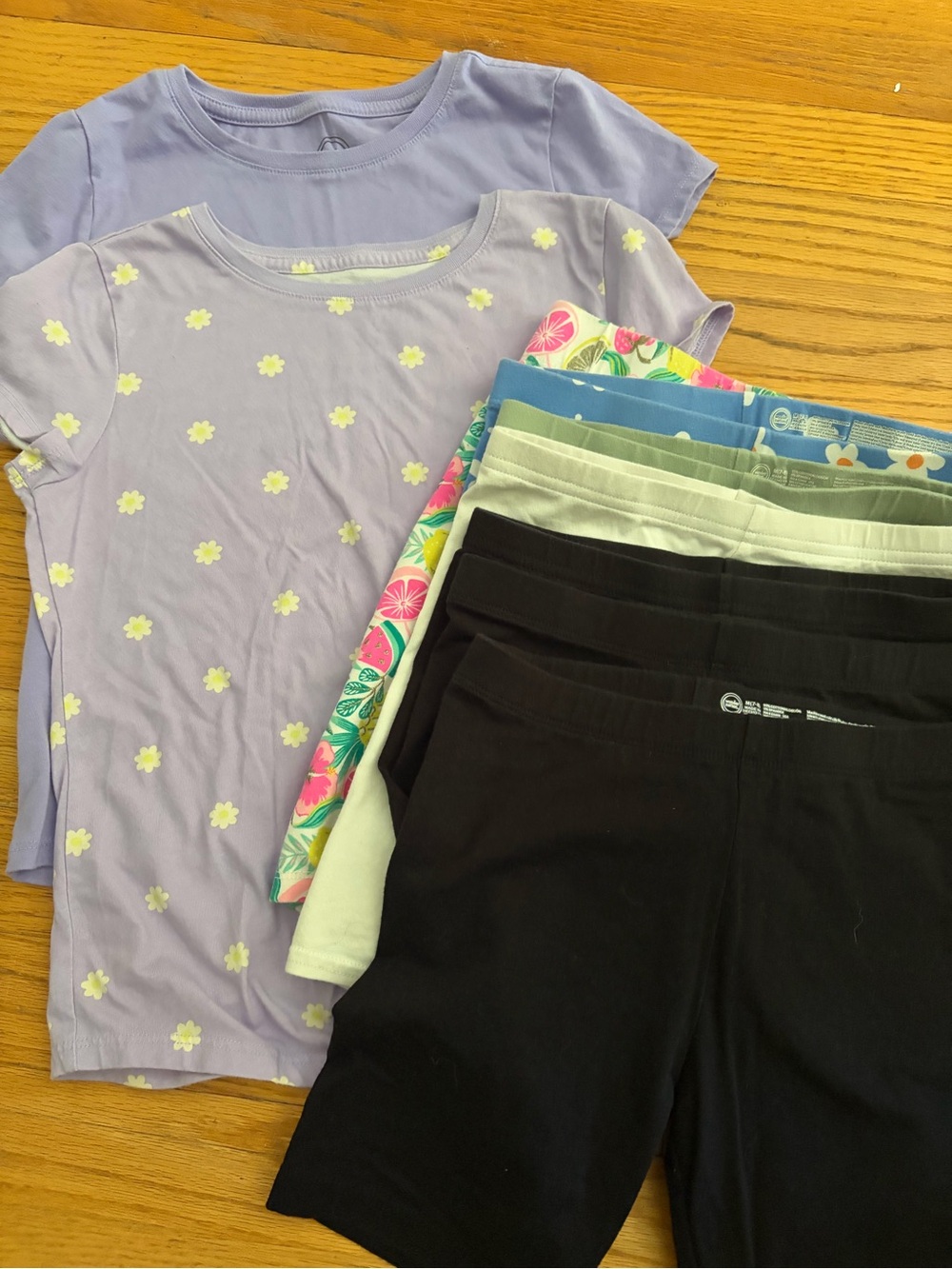 Girls' light purple shirts. Girls bike shorts. All size 7/8.